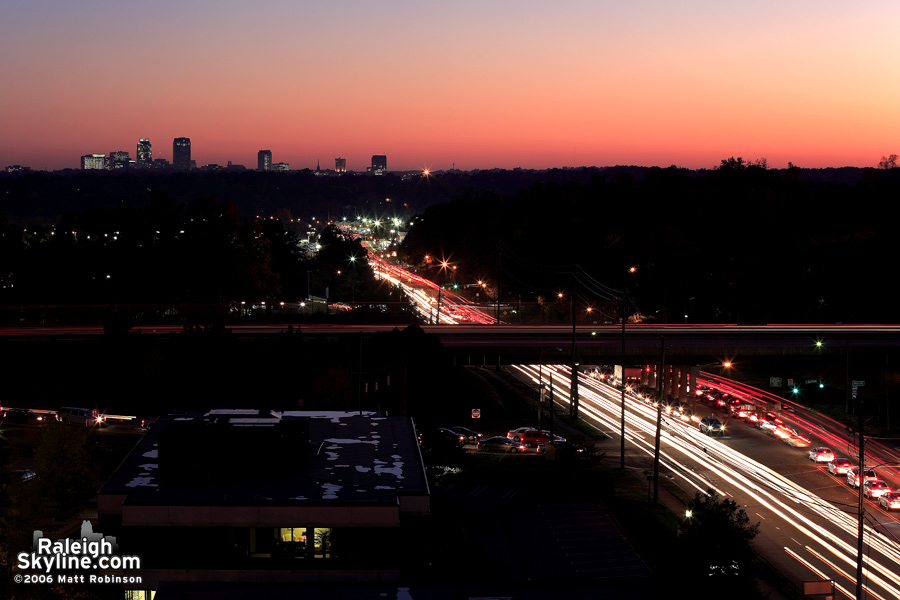 Traffic streams back and forth on Wake Forest Road.