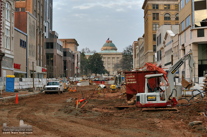 The North Carolina State Capitol Building sits at the end of the construction of Fayetteville Street.