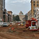 The North Carolina State Capitol Building sits at the end of the construction of Fayetteville Street.