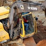 Construction worker in a backhoe.