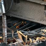 Sparks fly inside the debris of the old Raleigh convention center.