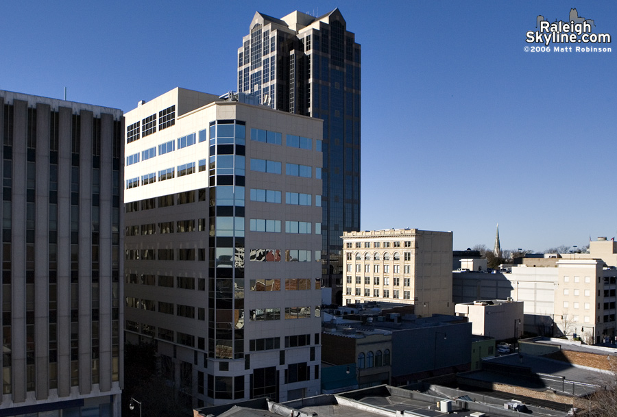 Collage of buildings and rooftops.