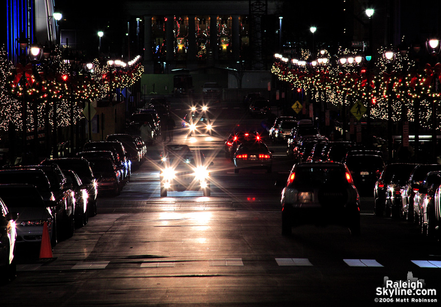 Lit trees line F Street.