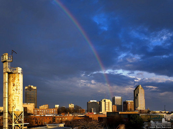 A rainbow cascades down and rests on downtown Raleigh.