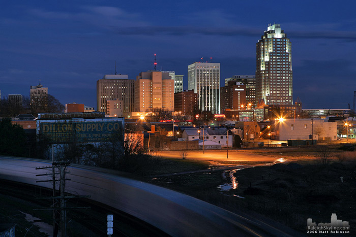 A CSX train creeps past Downtown Raleigh.