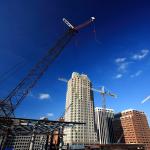 Cranes over the downtown skyline.