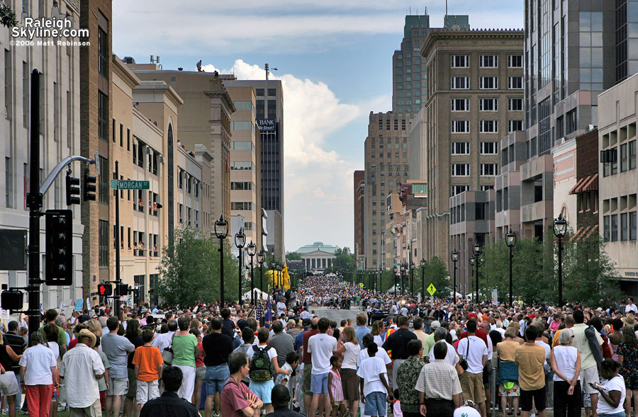 The crowd was pushed back to make way for the parade. 