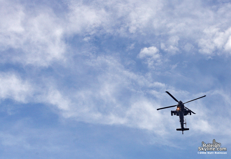 Apache Helicopter approaches Fayetteville Street. 