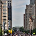 A news helicopter watches over a large crowd packing the brand new Fayetteville Street while Mayor Meeker spoke.