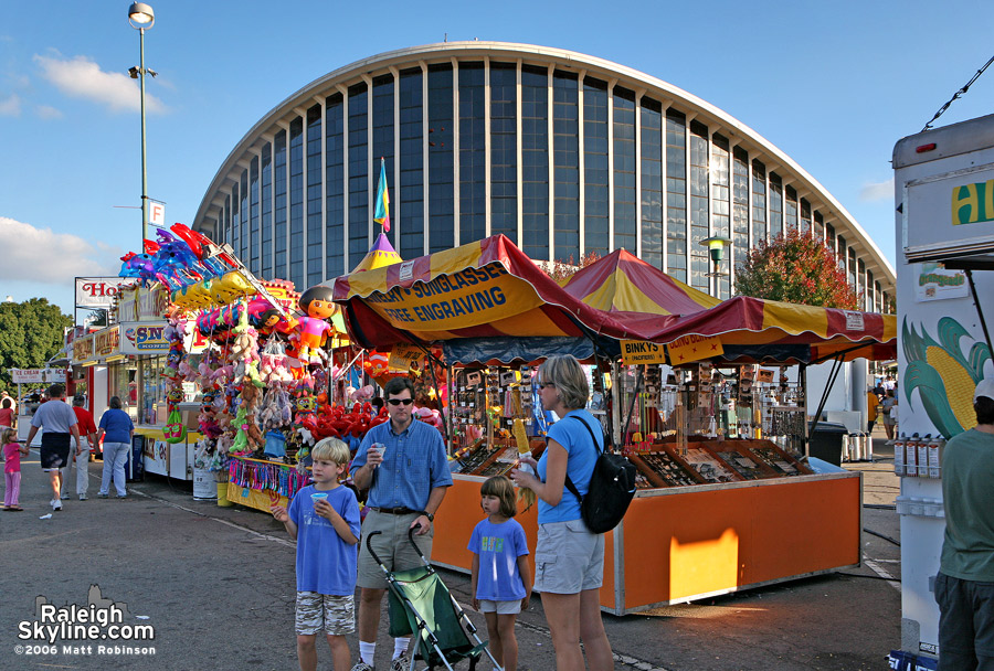 People enjoying snow cones in front of Dorton Arena.