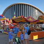 People enjoying snow cones in front of Dorton Arena.