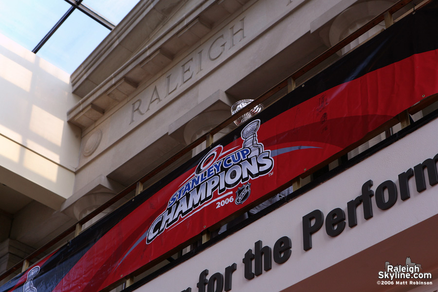 The Stanley Cup peeks over the railing at me.