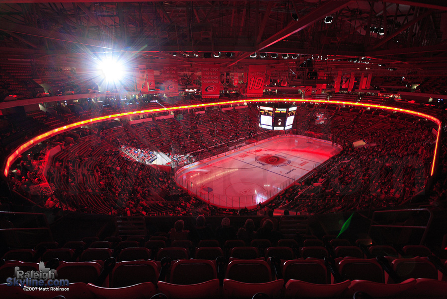 Spotlights swoosh around inside the RBC Center before a Carolina Hurricanes game.