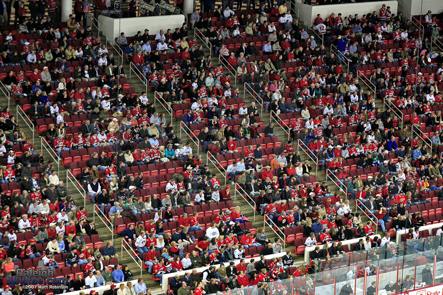 Fans watch the puck at the RBC Center.