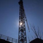 Sun peeks through the tower crane constructing the RBC Plaza Condos.