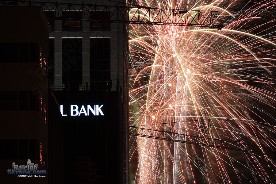 Crane silhouette in fireworks.