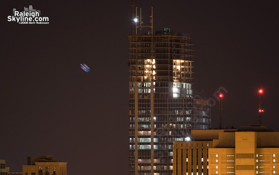 Keeping with the theme of the site, RBC Plaza and the hovering blimp at night.Bonus: The early stages of the RBC crown are in place.