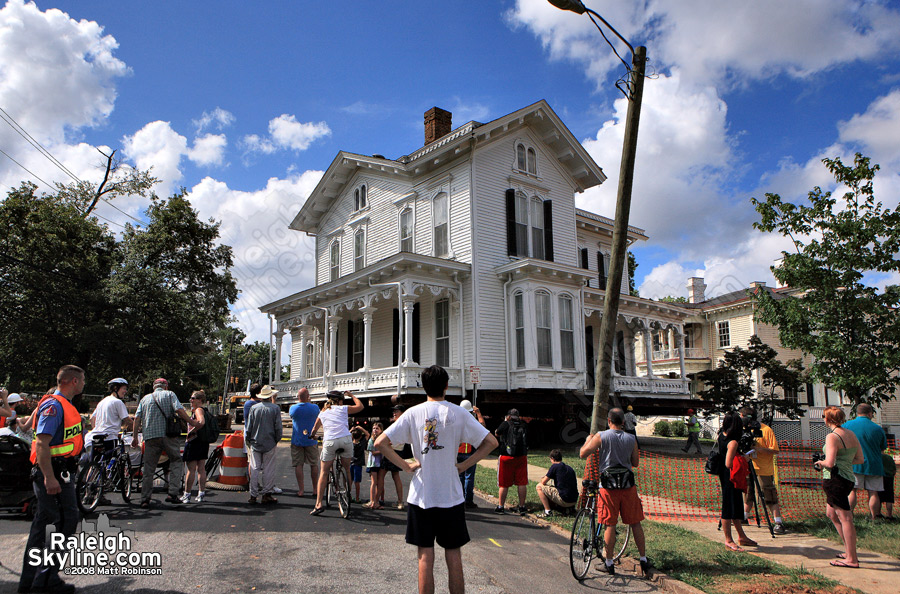 Crowds gather to watch a Raleigh house move a few blocks.