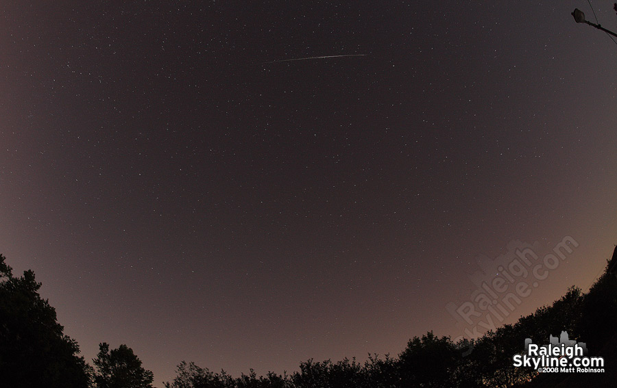 Perseid meteor streaks across the starry sky.