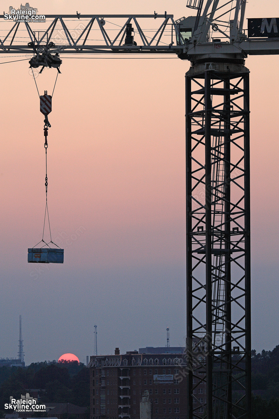 Empire Properties L Building tower crane at sunset