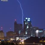 A lightning bolt squeezes between RBC Plaza and Two Hannover Square.