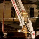 Raleigh Firemen descend ladder.