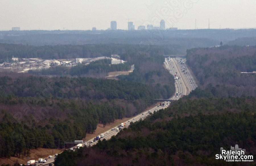 Aerial of Interstate 40 and Raleigh skyline.