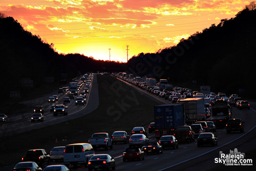 I-440 Beltline traffic at sunset