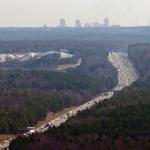 Aerial of Interstate 40 and Raleigh skyline.