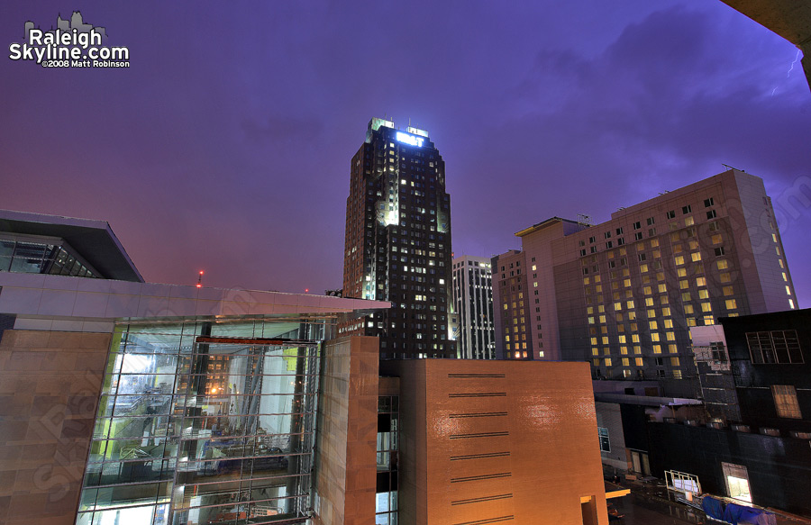 Lightning brightens the sky near the convention center.