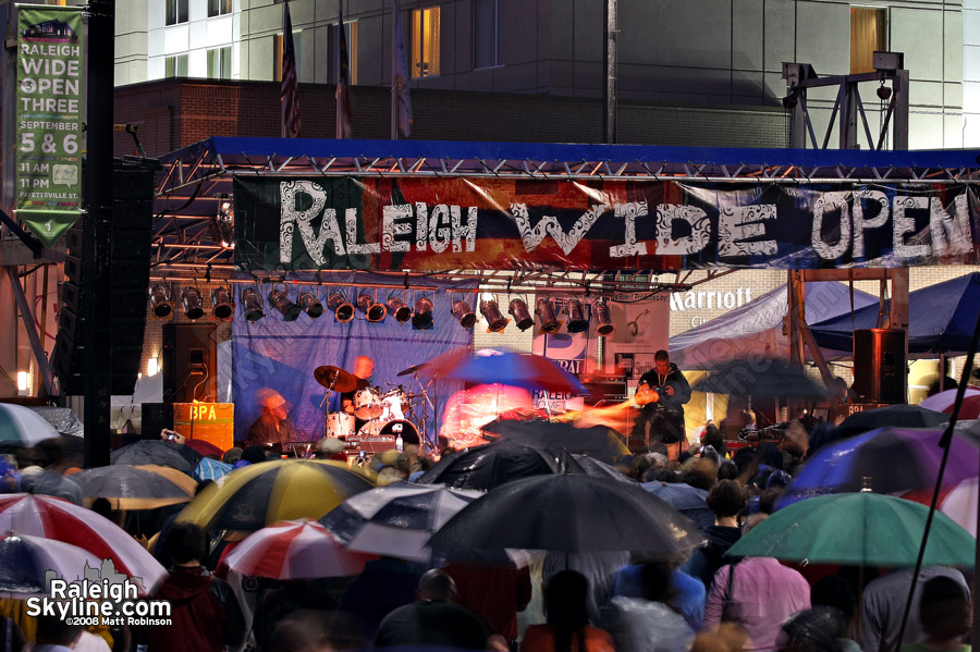 Umbrellas nearly outnumbered people on Friday night at the main stage.