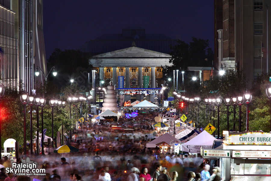 Fayetteville Street flows with a river of people.