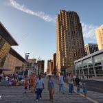 People walk along Salisbury Street checking out the new Raleigh Convention Center.