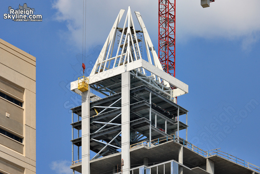 Welder works atop the Raleigh Skyline