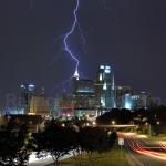 Lightning strikes behind the cityscape of downtown Raleigh