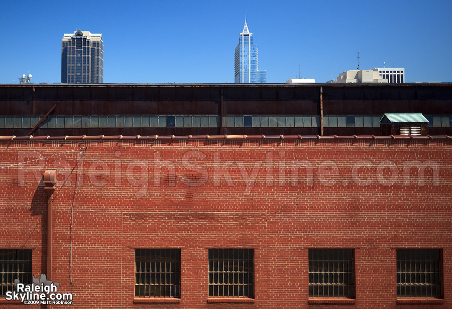 Wachovia Capitol Center and RBC Plaza peek over Dillon Supply Warehouse