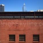 Wachovia Capitol Center and RBC Plaza peek over Dillon Supply Warehouse