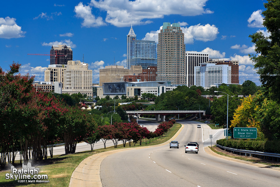 Blue sky and clouds with the Raleigh skyline
