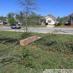 Metal and brick fence damaged by Tornado