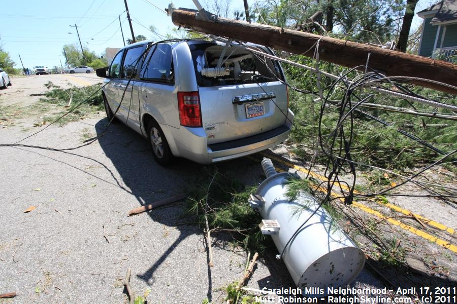 Transformer and utility poll down on a van along Maywood Avenue