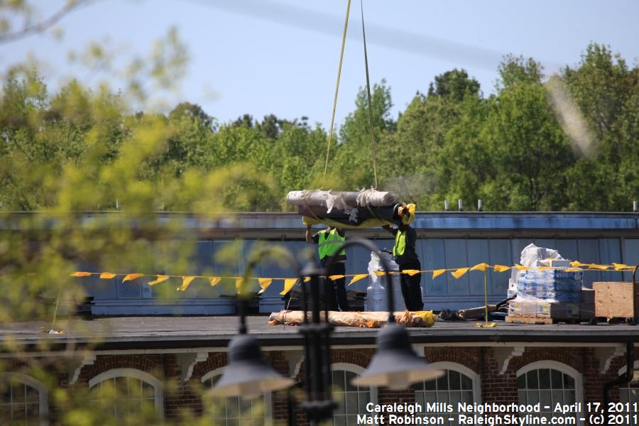 Workers atop Caraleigh Mills Condos