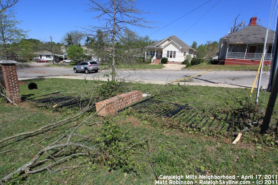 Metal and brick fence damaged by Tornado