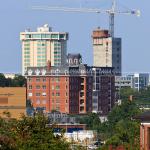 SECU elevator shafts rise to the height of the Clarion Hotel