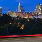 Night time city skyline from Umstead Drive with car traffic, Raleigh, NC