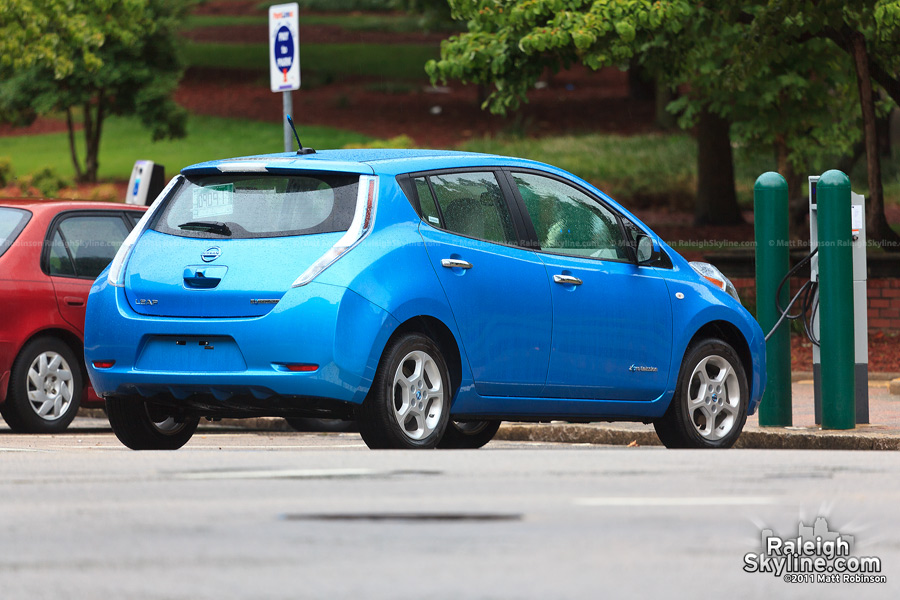 A Nissan Leaf charges its batteries at Nash Square (also spotted a Tesla Roadster charging here)