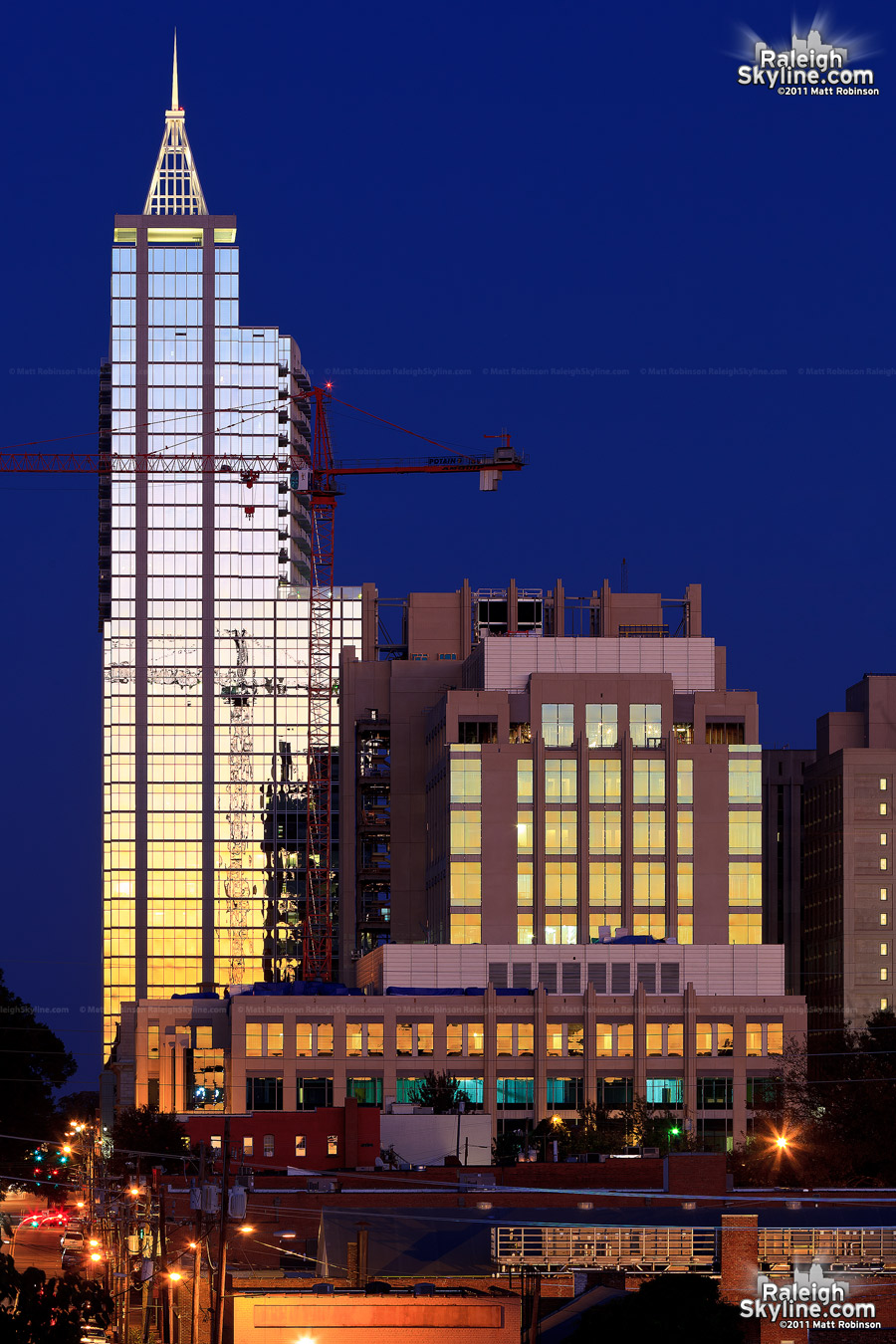 RBC Plaza and the Wake County Justice Center reflect the western sky after sunset