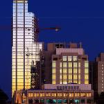 RBC Plaza and the Wake County Justice Center reflect the western sky after sunset