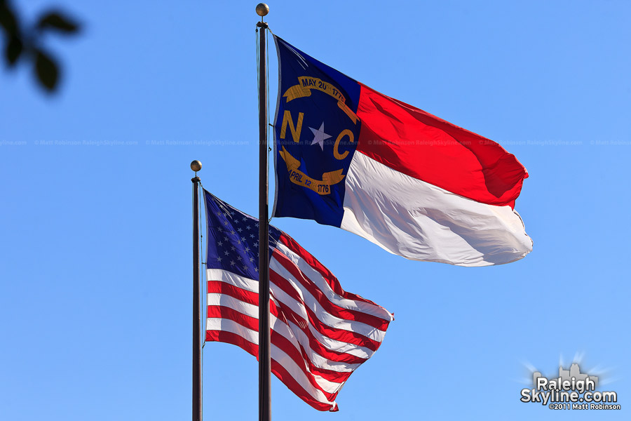 State flag of North Carolina with American flag