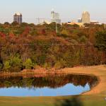 Raleigh peeks over the autumn colors from Lonnie Poole Golf Course