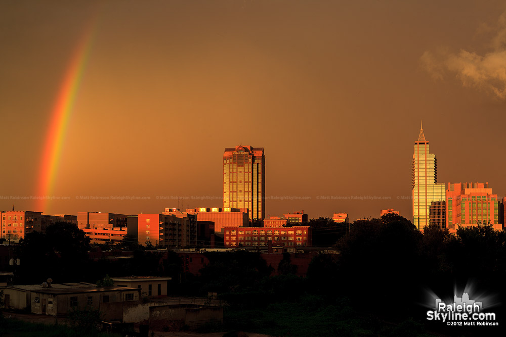 Golden sunset and rainbow with Wells Fargo Capitol Center and PNC Plaza